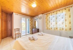 Postel nebo postele na pokoji v ubytování VILLA THEO