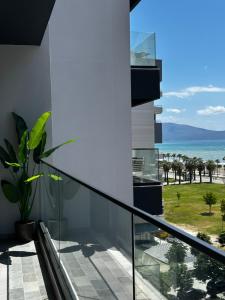 a balcony with a view of the ocean at LARIMAR Lungomare Vlore in Vlorë