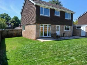 a house with a green lawn in front of it at 20 Fairview Chepstow in Chepstow