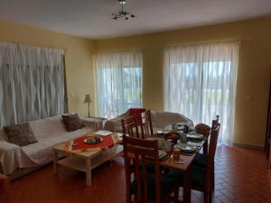 a living room with a table and a couch at Villa Mangano in Afantou