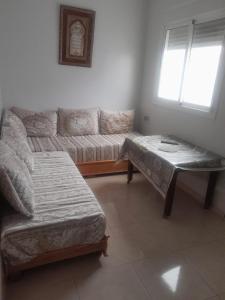 Voodi või voodid majutusasutuse Alhoceima Appartement Loft toas