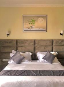 Postel nebo postele na pokoji v ubytování Calian hotel