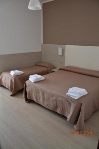 Säng eller sängar i ett rum på Hotel Villa Alberta B&B