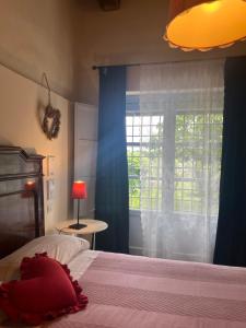 Postel nebo postele na pokoji v ubytování CasaLeMonache appartamenti in casale in Umbria