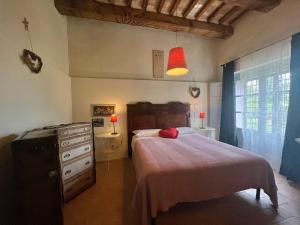 Postel nebo postele na pokoji v ubytování CasaLeMonache appartamenti in casale in Umbria