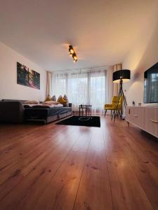 a large room with a bed and a table at Schwarzwald-Idylle in Schonach in Schonach