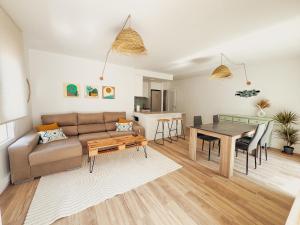 a living room with a couch and a table at Almar Albir in Albir