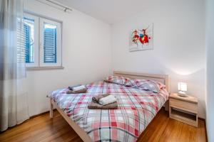 Posteľ alebo postele v izbe v ubytovaní Apartman Elephant