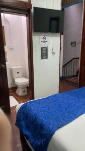 Кровать или кровати в номере Hotel Casa de la Luz