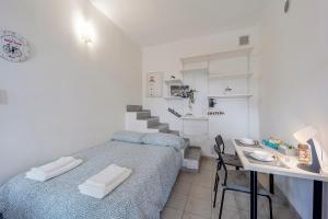 Un ou plusieurs lits dans un hébergement de l'établissement Il Gattino di Sanremo - Piccolo monolocale centro e stazione del treno