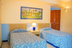 Postel nebo postele na pokoji v ubytování Zuana Beach Resort