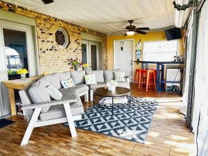 a living room with a couch and a table at Lake Francis Lily Pad in Lake Placid