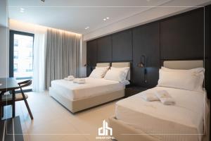 Postel nebo postele na pokoji v ubytování DREAM HOTEL SARANDA