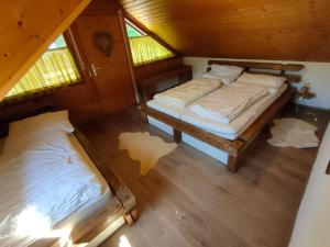 Postel nebo postele na pokoji v ubytování Ferienhaus Am Hermannsberg, Oberschönau