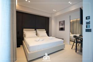 Postel nebo postele na pokoji v ubytování DREAM HOTEL SARANDA