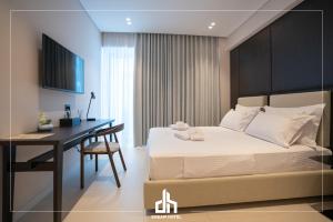 Postel nebo postele na pokoji v ubytování DREAM HOTEL SARANDA