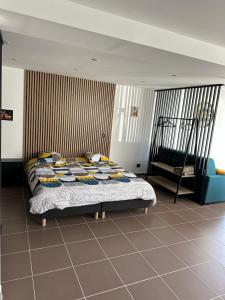 a bedroom with a bed in a room at Loft de la louve in Villeveyrac