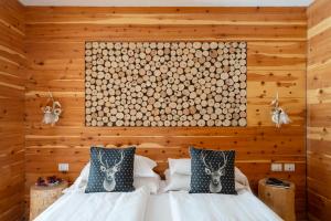 Ένα ή περισσότερα κρεβάτια σε δωμάτιο στο Hotel Dahu