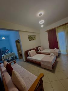 Postel nebo postele na pokoji v ubytování Draci Apartments