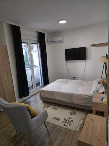 TV a/nebo společenská místnost v ubytování Kmb Apartment