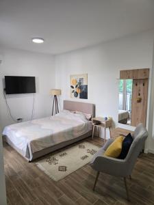 Postel nebo postele na pokoji v ubytování Kmb Apartment