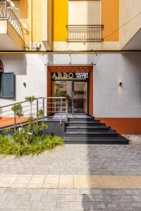 an entrance to a building with stairs in front at Arbo Boutique Hotel in Durrës