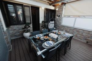 a table with plates of food on a patio at Casa do Fontanario em Viana do Castelo in Viana do Castelo