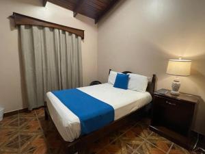Postelja oz. postelje v sobi nastanitve Hostal Marias