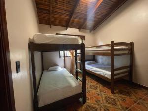 Postelja oz. postelje v sobi nastanitve Hostal Marias