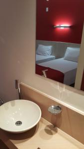Giường trong phòng chung tại Go Inn Vitória