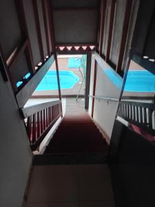 a view from the top of a stairway in a building at Pousada Lagoa Azul in Penha