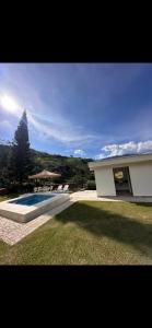 a house with a swimming pool in a yard at La Miel in Barbosa