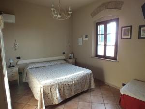 Posteľ alebo postele v izbe v ubytovaní Agriturismo San Martino