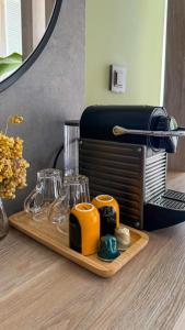 a wooden tray with glasses on a table at Leos Apartments Apart1 in Side