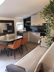 a kitchen and dining room with a table and chairs at Villa Marica in Trogir