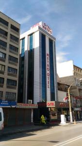 a building on the corner of a city street at Metro Otel in Izmir