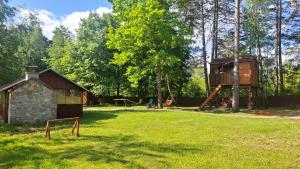 a park with a tree house and a playground at Tesla`s Valley in Smiljan +40 photos