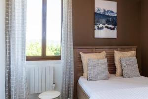 Ένα ή περισσότερα κρεβάτια σε δωμάτιο στο Appartement T3 portes d'Annecy Sauna