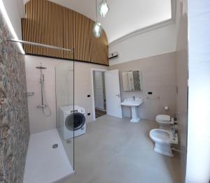 a bathroom with a toilet and a sink at Dimora dei Sicani in Aragona +118 photos