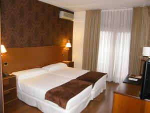 Łóżko lub łóżka w pokoju w obiekcie Oca Ipanema Hotel