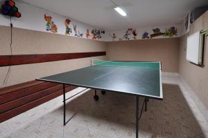 a ping pong table in the corner of a room at Pokoje Gościnne Janina in Zakopane