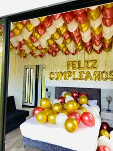 a display of apples and balloons on a table at Luxe Glamping in Moniquirá