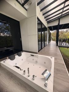 a bath tub in the middle of a house at Luxe Glamping in Moniquirá +40 photos