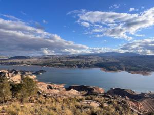 a view of a large body of water on a hill at Casa Cueva, Cuevas del Emir in Freila
