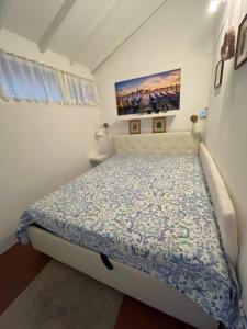 Postel nebo postele na pokoji v ubytování Casa del Lampone - Bungalow mit Gardaseeblick + 52 fotografií