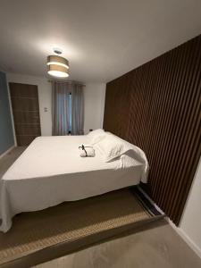 Postel nebo postele na pokoji v ubytování Hospedaje cómodo en El Rosario + 2 fotografie