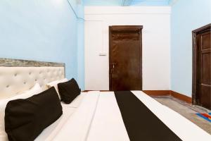 Katil atau katil-katil dalam bilik di Hotel O Mannat