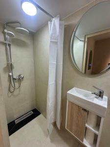 a bathroom with a sink and a mirror at Mazagan Home in El Jadida