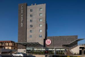 a hotel with a car parked in front of it at Casa Andina Select Tacna in Tacna
