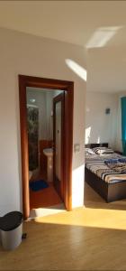 Postel nebo postele na pokoji v ubytování Rexha Apartments